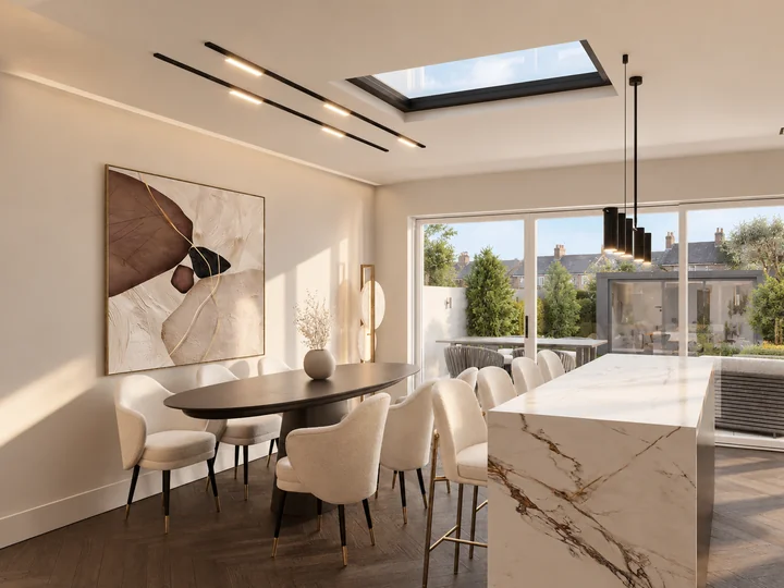 Dining table and upholstered chairs beside the garden doors